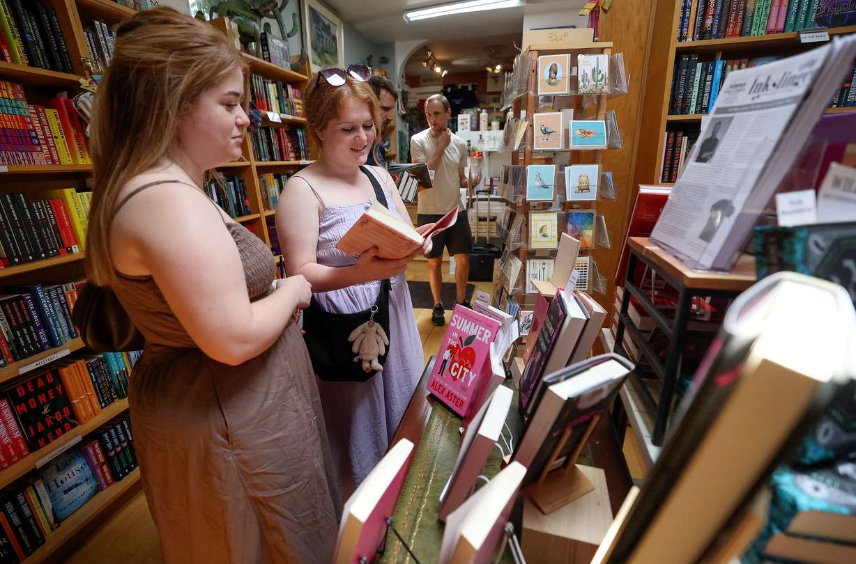Madison Miller and Madeline Miller browse books at The King’s English Bookshop in Salt Lake City on July 22. Co-owners Anne Holman and Calvin Crosby have deep ties to the store.
