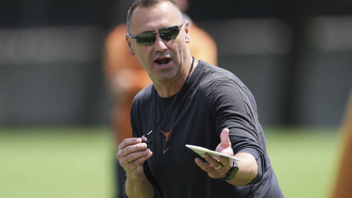 Texas head coach Steve Sarkisian gives instruction during the team's NCAA college football practice in Austin, Texas, Wednesday, July 30, 2025.
