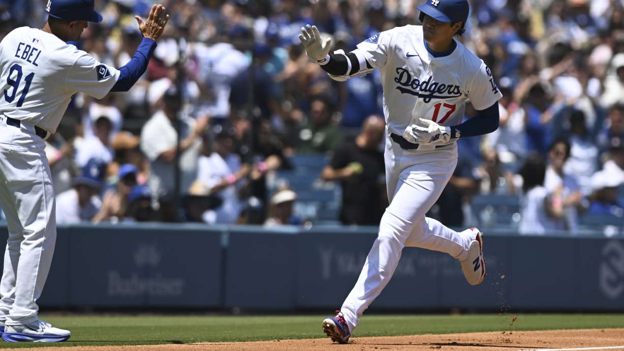 Los Angeles Dodgers designated hitter Shohei Ohtani runs on his solo home run against the Toronto Blue Jays during the first inning of a baseball game Sunday, Aug. 10, 2025, in Los Angeles.