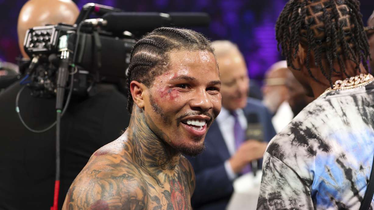 FILE- Gervonta "Tank" Davis smiles in the ring after knocking out Frank Martin during the WBA lightweight championship boxing bout, June 15, 2024, in Las Vegas.