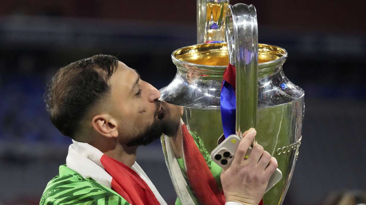 FILE - PSG's goalkeeper Gianluigi Donnarumma kisses the trophy after the Champions League final soccer match between Paris Saint-Germain and Inter Milan at the Allianz Arena in Munich, Germany, Saturday, May 31, 2025.