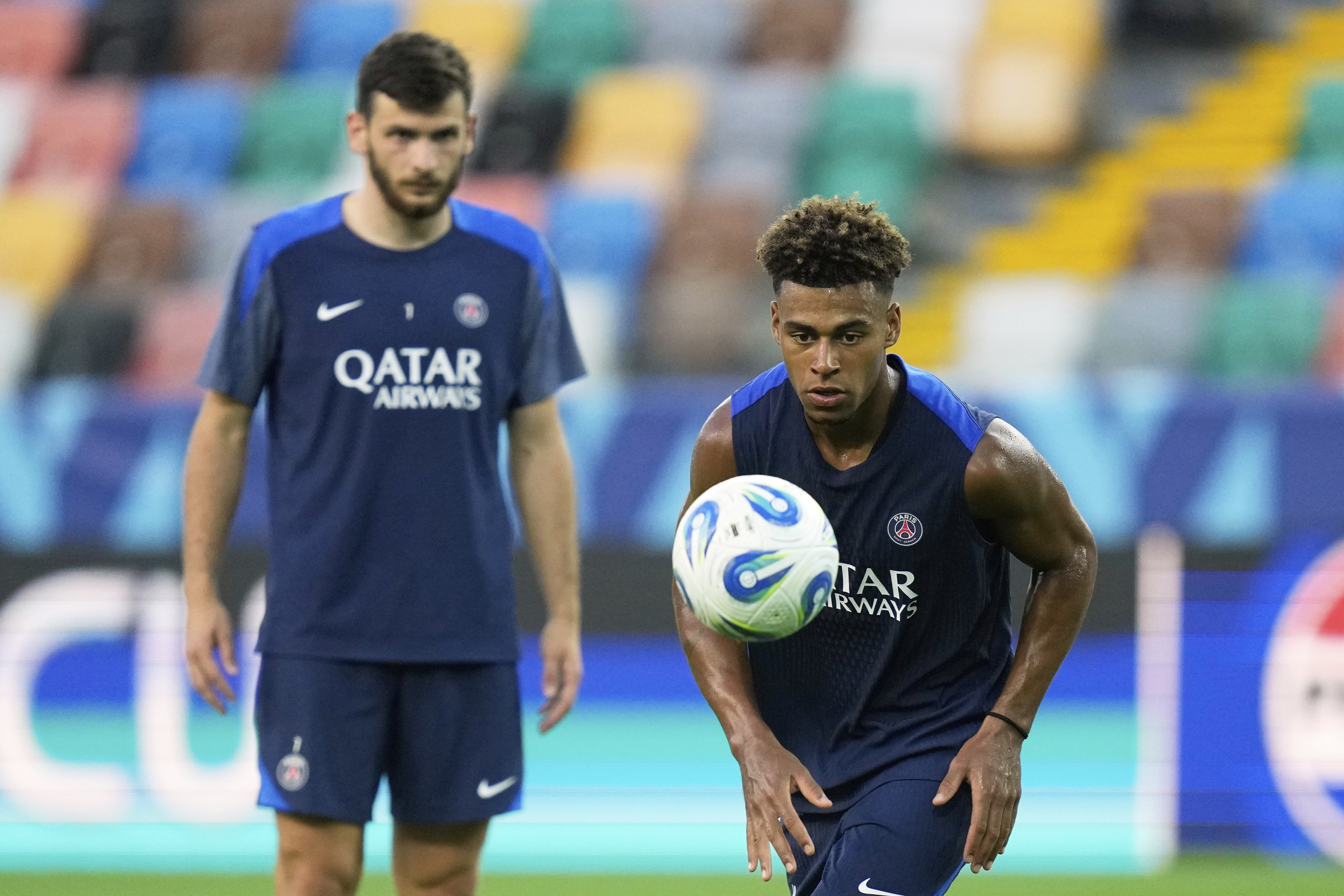PSG's Desire Doue prepares to take a shot during a training session in Udine, Tuesday, Aug. 12, 2025 ahead of Wednesday's UEFA Super Cup soccer match between Paris Saint-Germain and Tottenham Hotspur.