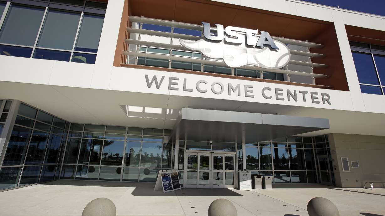 FILE - The entrance to the welcome center at the USTA National Campus is seen in Orlando, Fla, Tuesday, Dec. 12, 2017. T