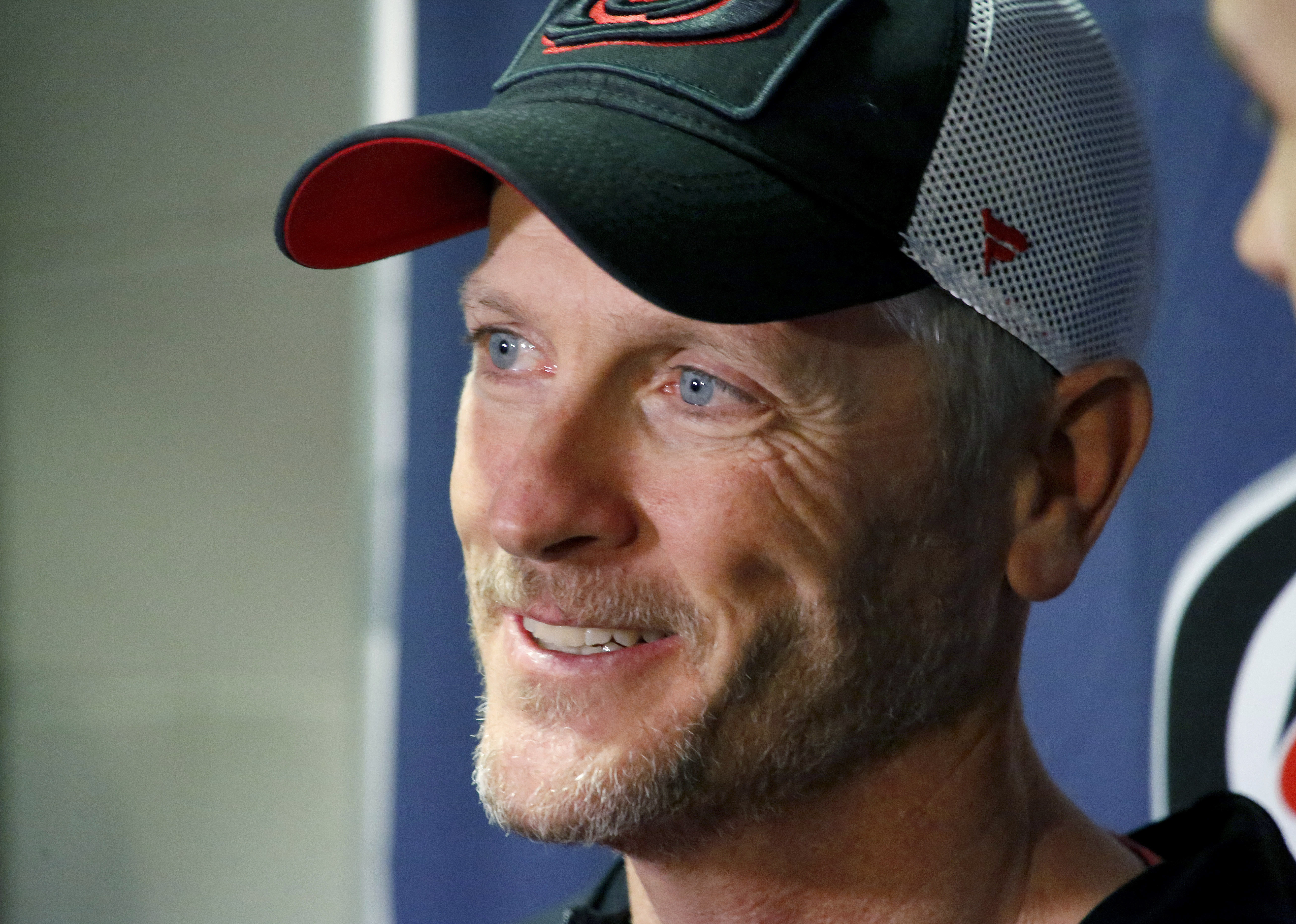 FILE - Tom Dundon, majority owner of the Carolina Hurricanes talks to the media about his $250 million investment in the Alliance of American Football league before the start of an NHL hockey game between the New York Rangers and the Carolina Hurricanes in Raleigh, N.C, Tuesday, Feb. 19, 2019.