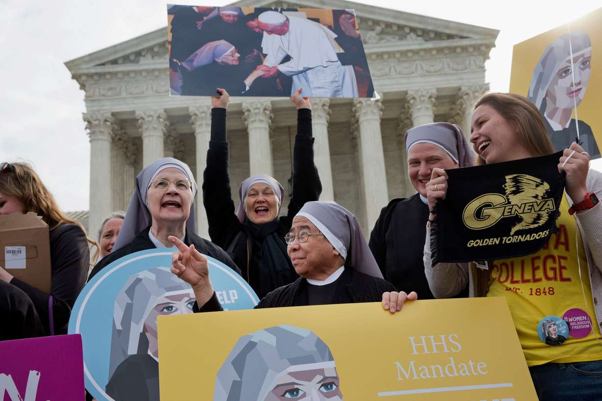 Nuns with the Little Sisters of The Poor, including Sister Celestine, left, and Sister Jeanne Veronique, center, rally outside the Supreme Court in Washington, March 23, 2016, as the court hears arguments to allow birth control in health care plans in the Zubik v. Burwell case.