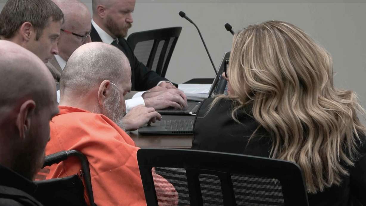 Death row inmate Ralph Menzies sits with his attorneys while listening to testimony during a commutation hearing for the convicted murderer at the Utah State Prison on Wednesday.