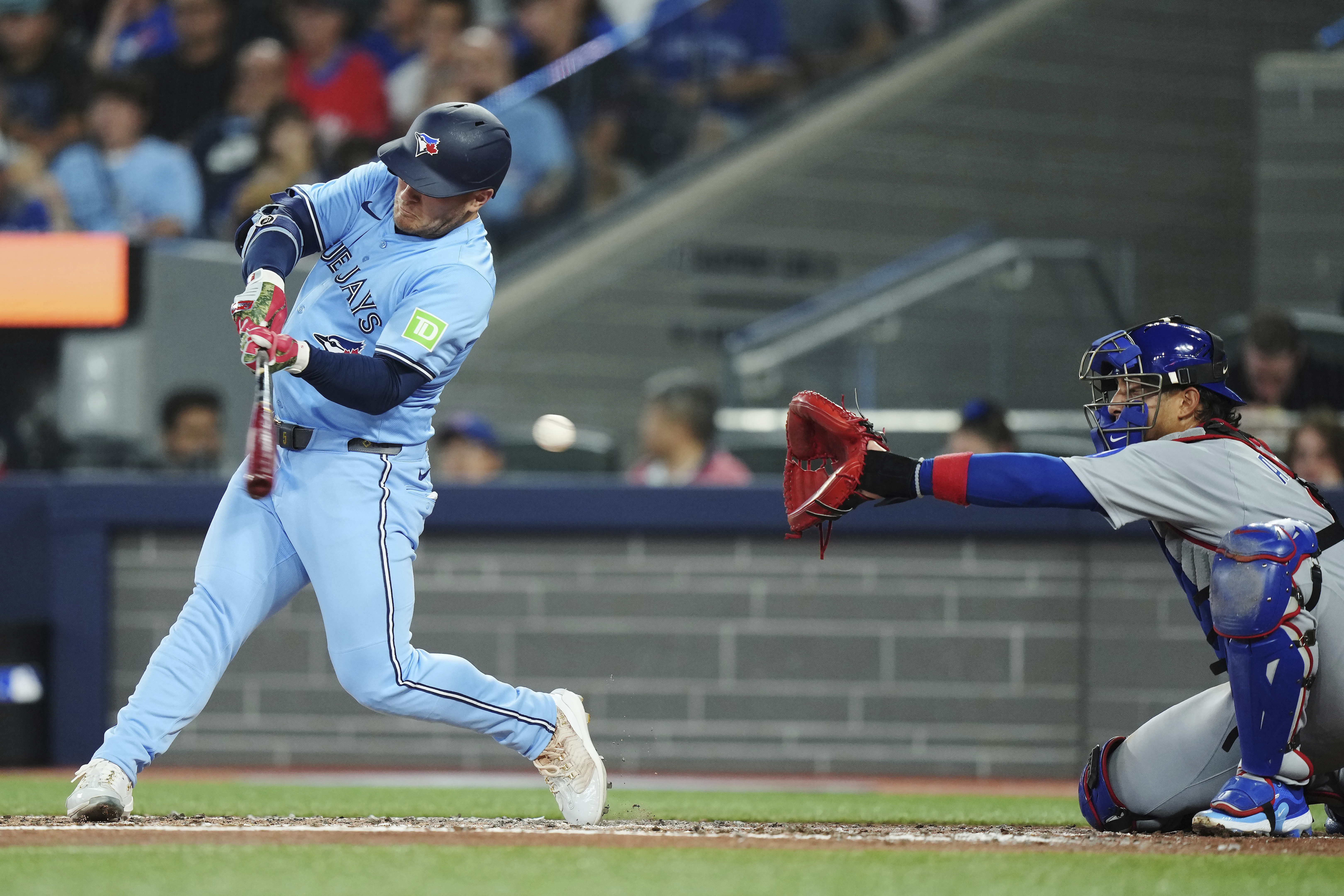Toronto Blue Jays' Daulton Varsho (left) strikes out as Chicago Cubs catcher Miguel Amaya (9) makes the catch during second inning MLB baseball action in Toronto on Wednesday, August 13, 2025.