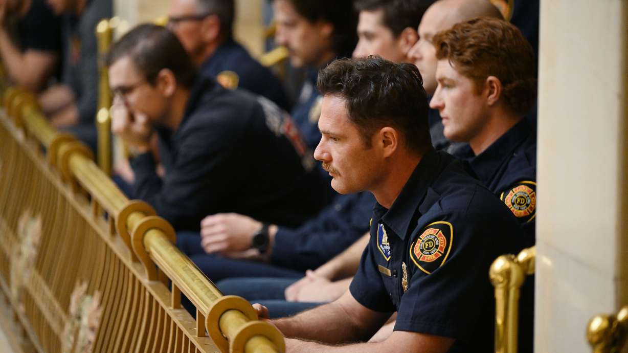 Firefighters sit at the state Capitol on Feb. 4. Organizers behind efforts to overturn Utah's law barring public sector unions from collectively bargaining are asking lawmakers to fully repeal the law or allow voters to weigh in during next year's referendum.