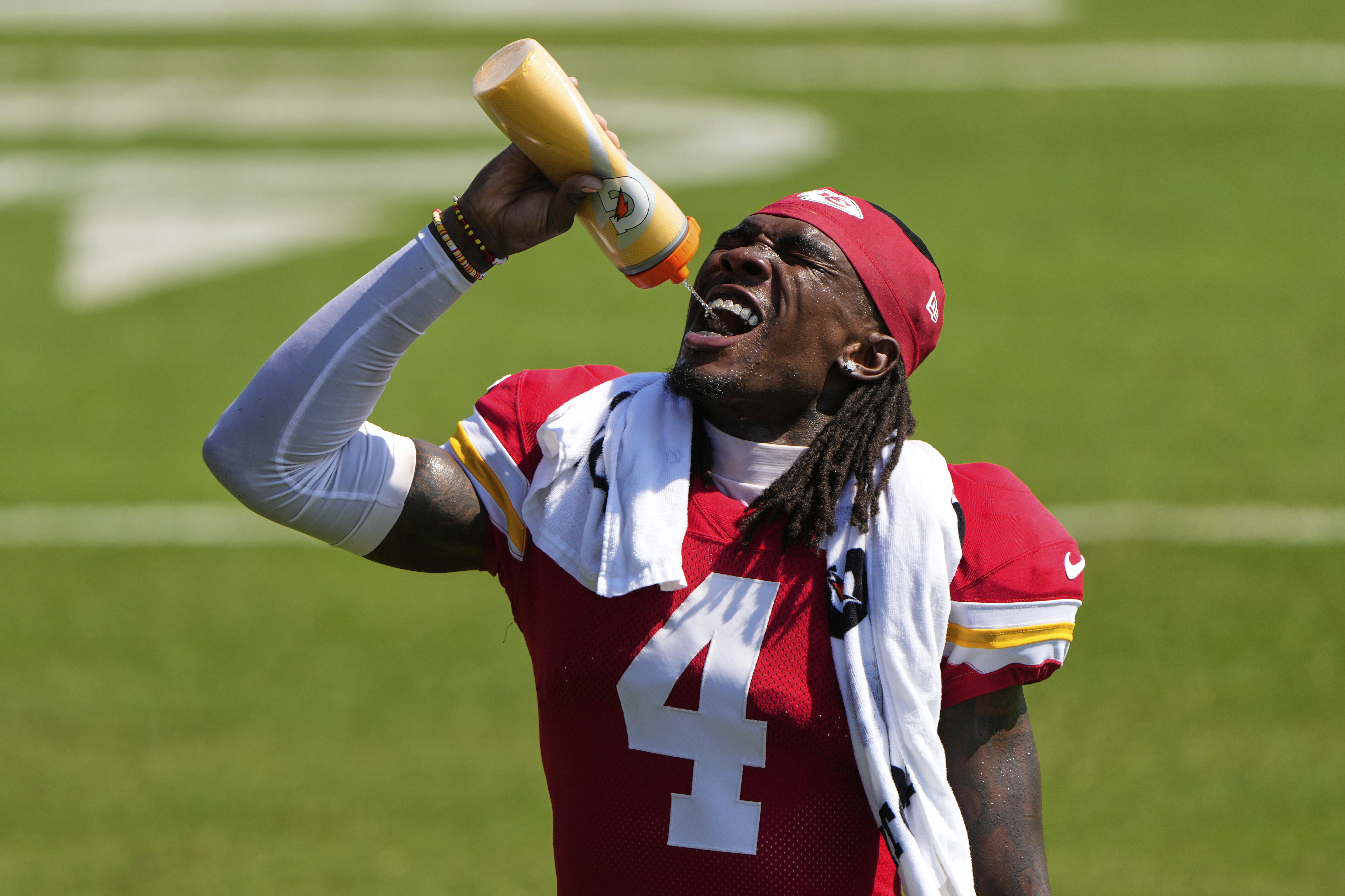 Kansas City Chiefs wide receiver Rashee Rice takes a drink during Back Together Weekend at the team's NFL football training camp, Sunday, July 27, 2025, in St. Joseph, Mo.