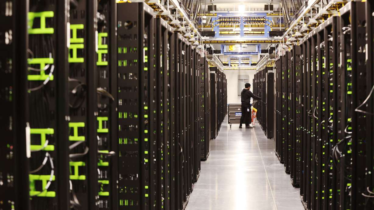 Work is performed on servers at Meta’s Eagle Mountain Data Center on Sept. 30, 2022. The world's largest data center campus may be coming to Utah, with a pair of companies planning to construct AI-ready hubs in Millard County.