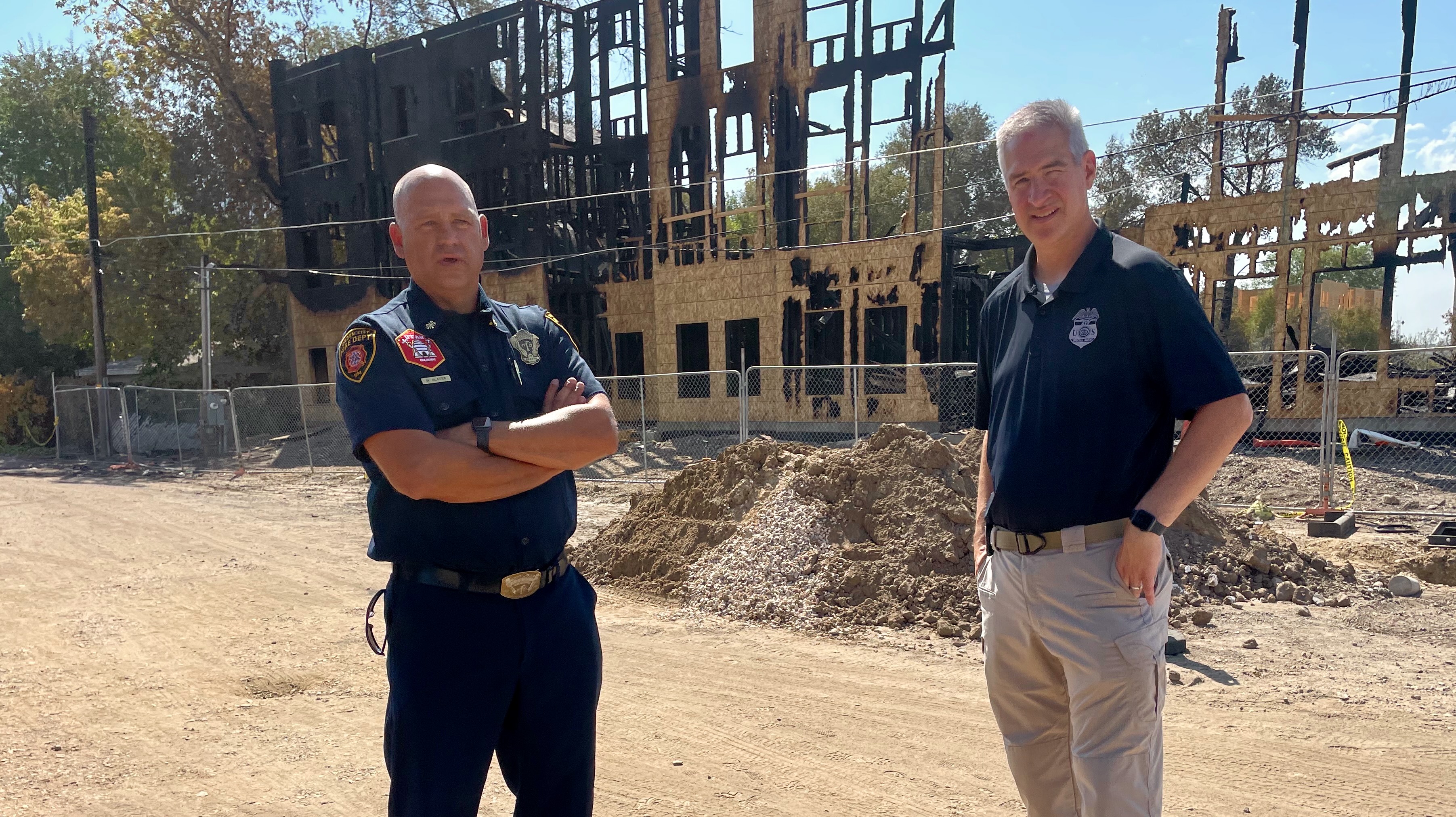 Ogden Fire Chief Mike Slater, left, and ATF Special Agent Brent Beavers on Thursday at the site of an Aug. 8 fire that destroyed an Ogden apartment building that was under construction.