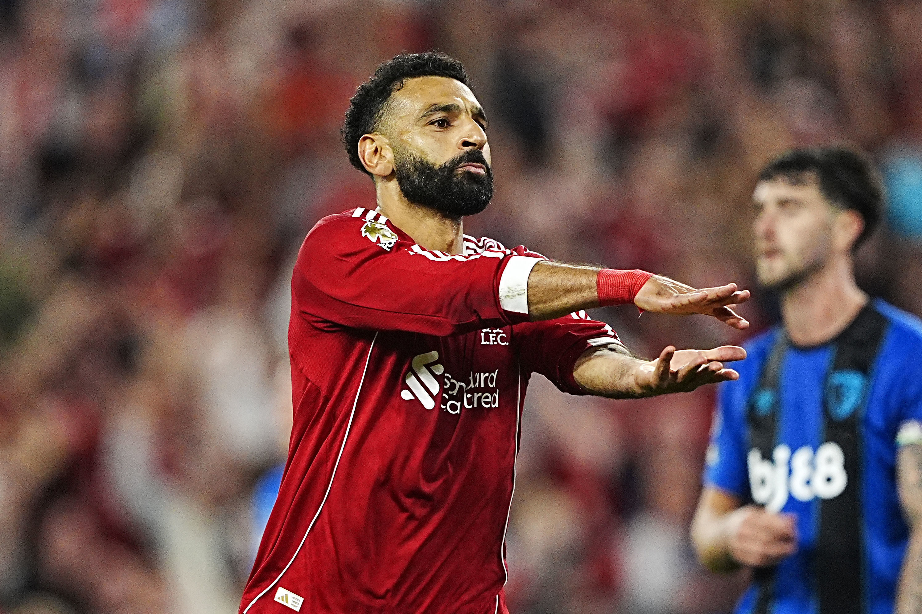 Liverpool's Mohamed Salah celebrates scoring their side's fourth goal of the game with a tribute to teammate Diogo Jota during the English Premier League soccer match between Liverpool and Bournemouth at Anfield, Liverpool, England, Friday Aug. 15, 2025.