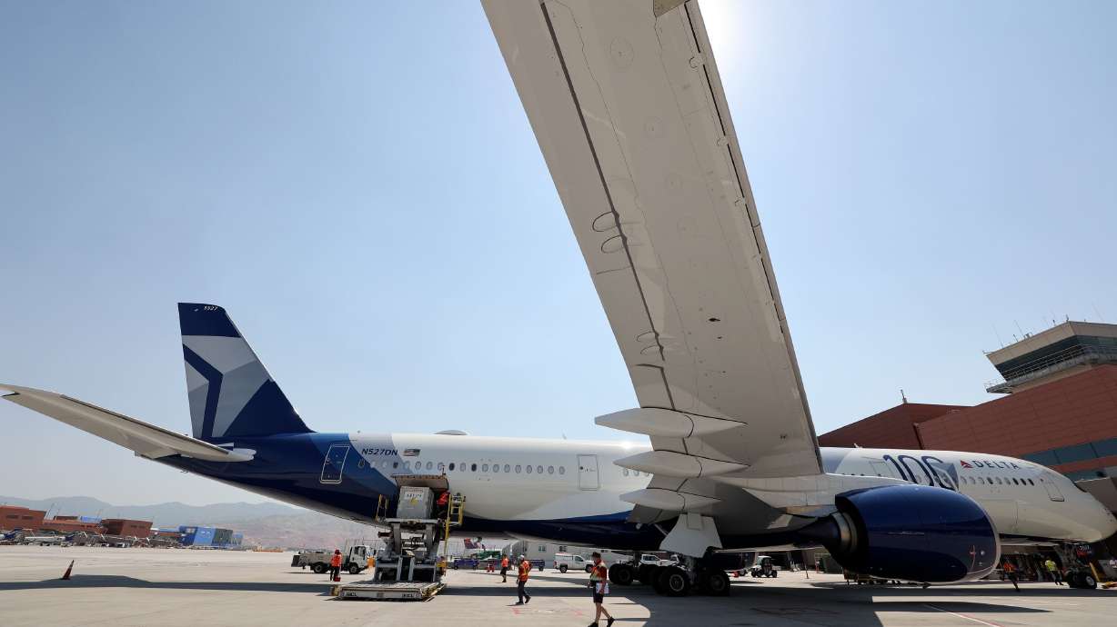 Crews load a Delta Air Lines plane at the Salt Lake City International Airport on June 12. The airport was named AirHelp's 2025 best airport in the U.S. on Friday.