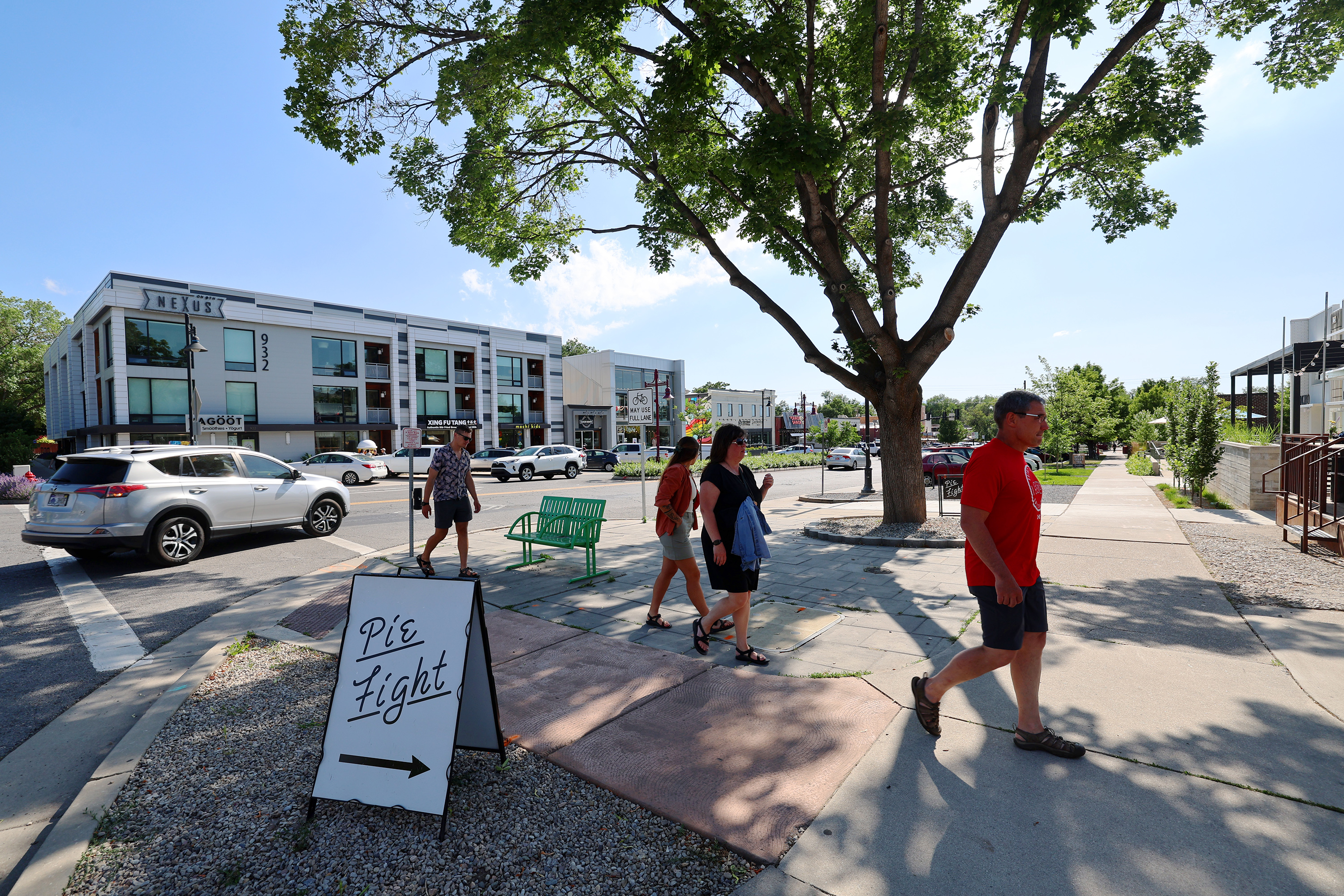 People walk on a sidewalk in Salt Lake City on June 20, 2023. Salt Lake City plans to spend millions on traffic safety projects through its capital improvement program, but city leaders and transportation officials say there's uncertainty for the future.