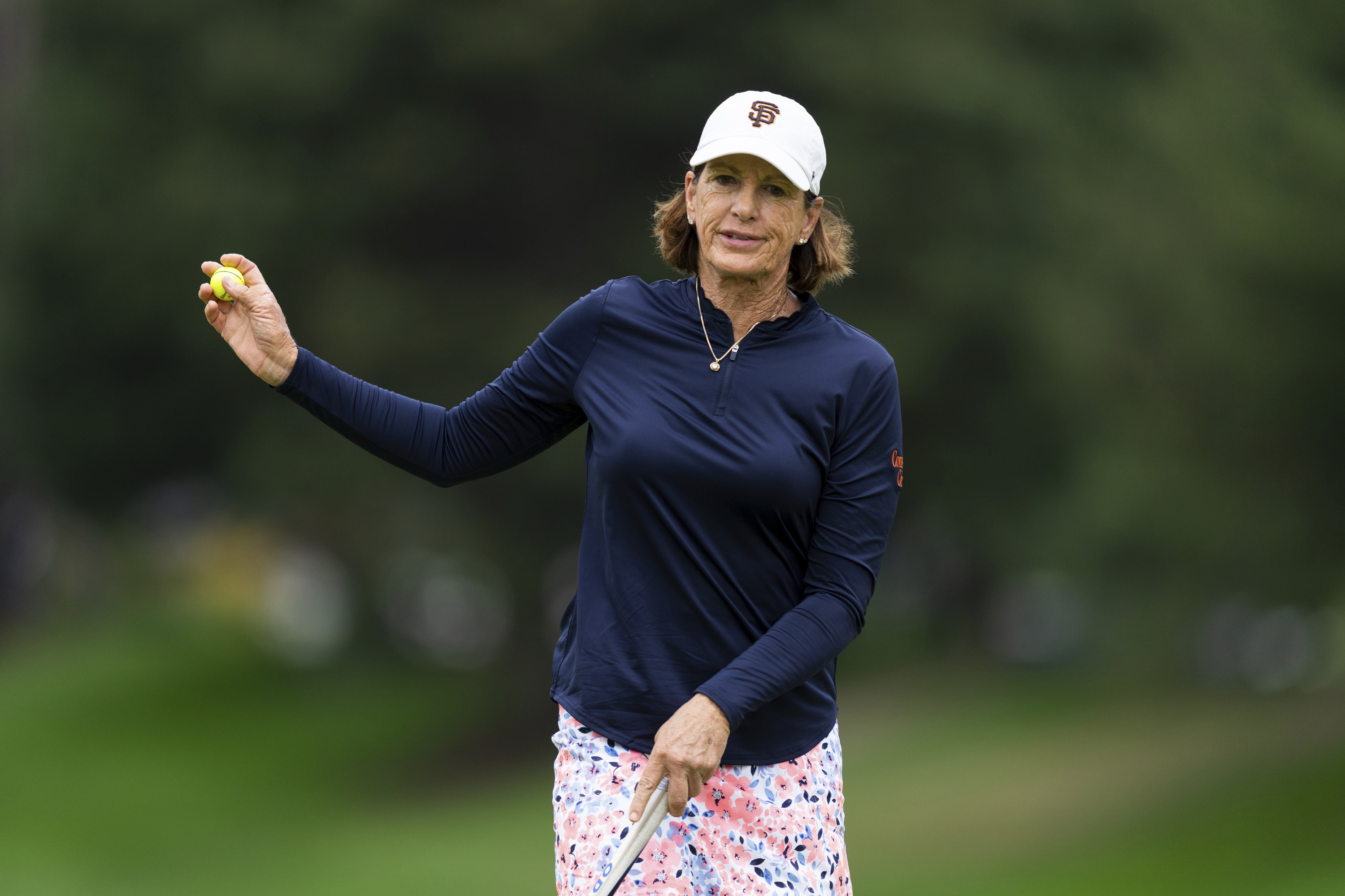 Juli Inkster, of the United States, reacts towards the crowd after finishing the first hole during the first round of the LPGA Portland Classic golf tournament at Columbia Edgewater in Portland, Ore., Thursday, Aug. 14, 2025. 