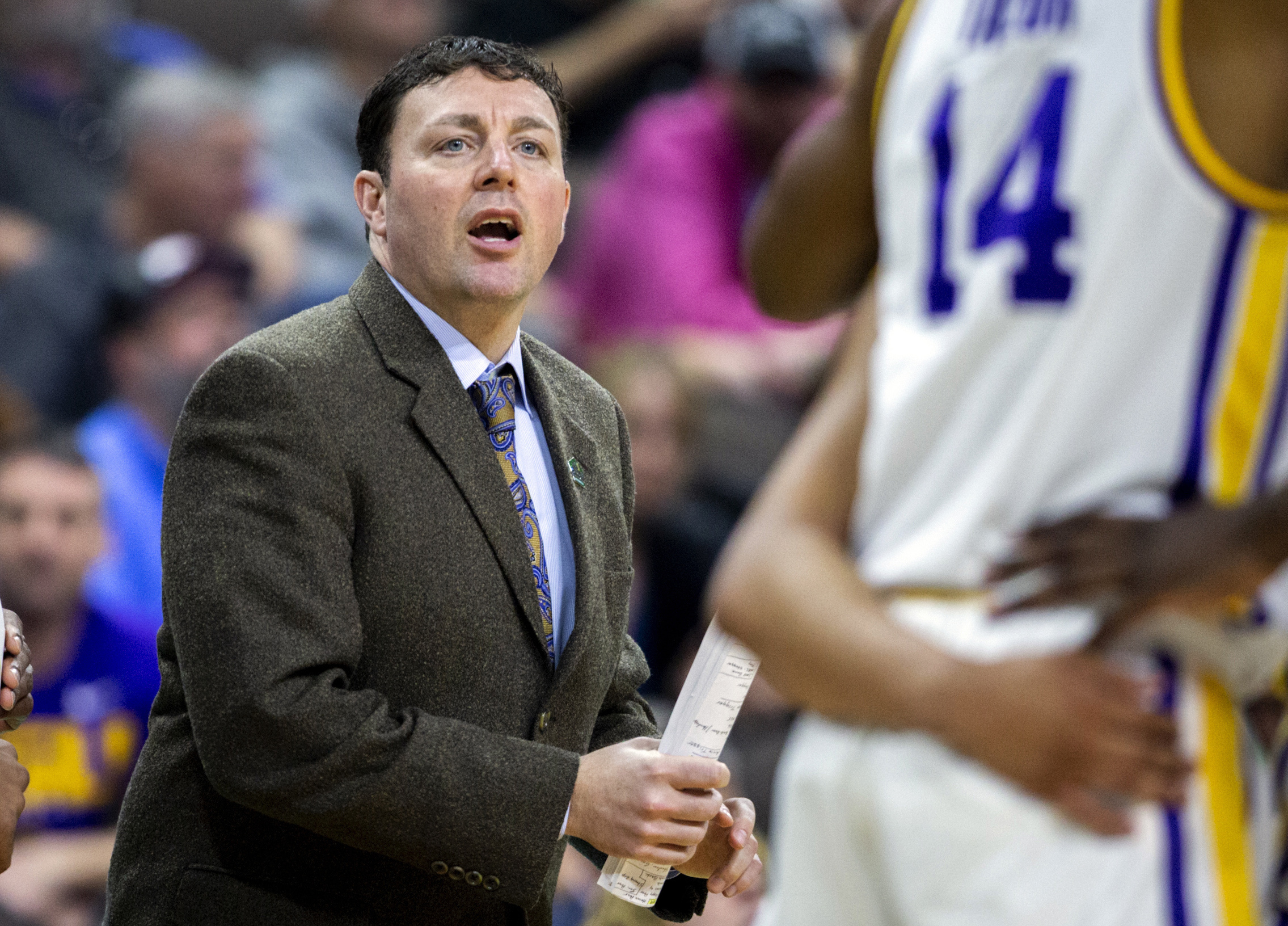 FILE - Then-LSU assistant coach Greg Heiar, center, shouts from the sideline during the team's NCAA men's college basketball tournament game against Yale in Jacksonville, Fla., March 21, 2019. 
