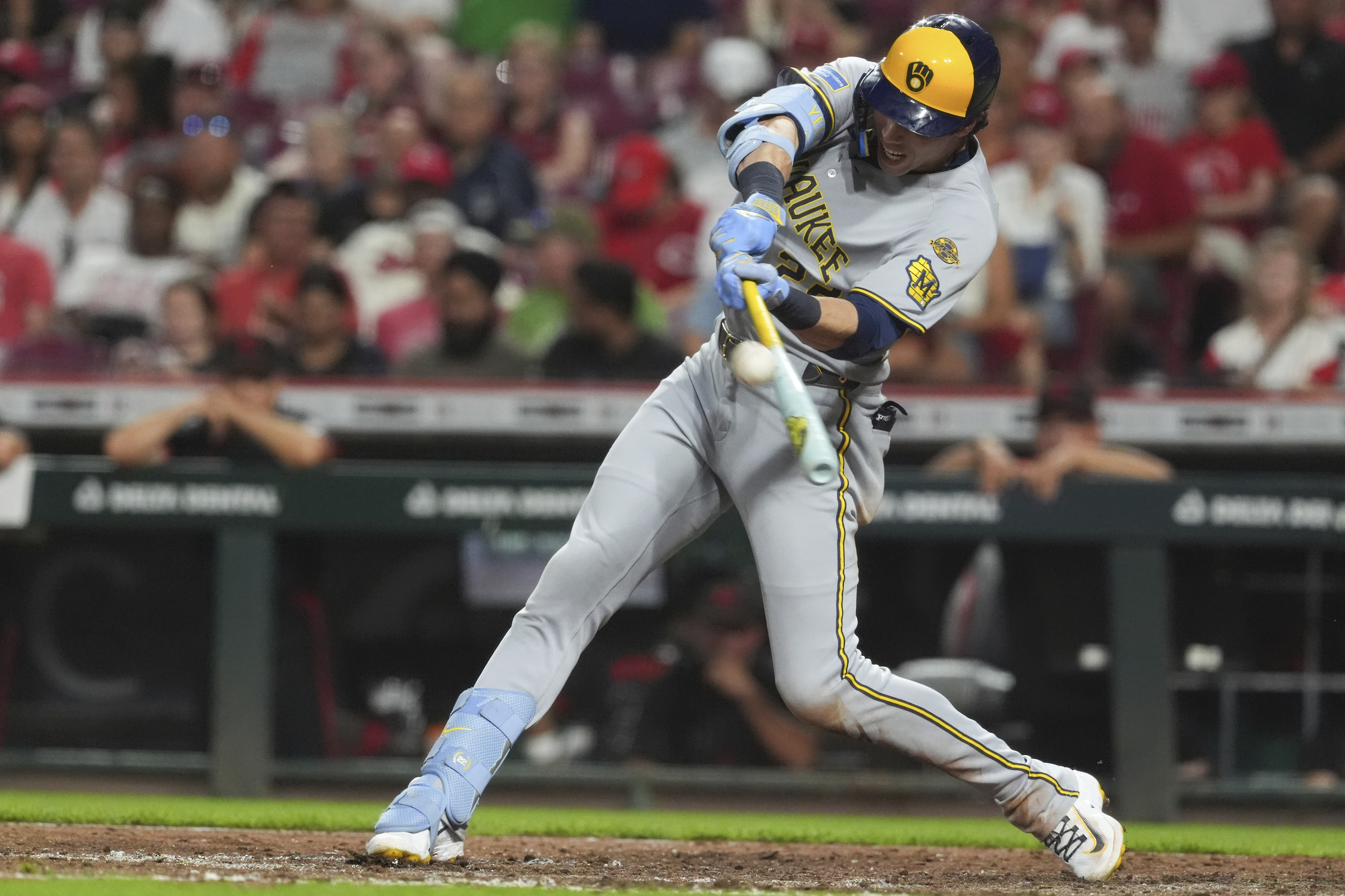Milwaukee Brewers' Christian Yelich hits a solo home run in the sixth inning of a baseball game against the Cincinnati Reds, Friday, Aug. 15, 2025, in Cincinnati. 