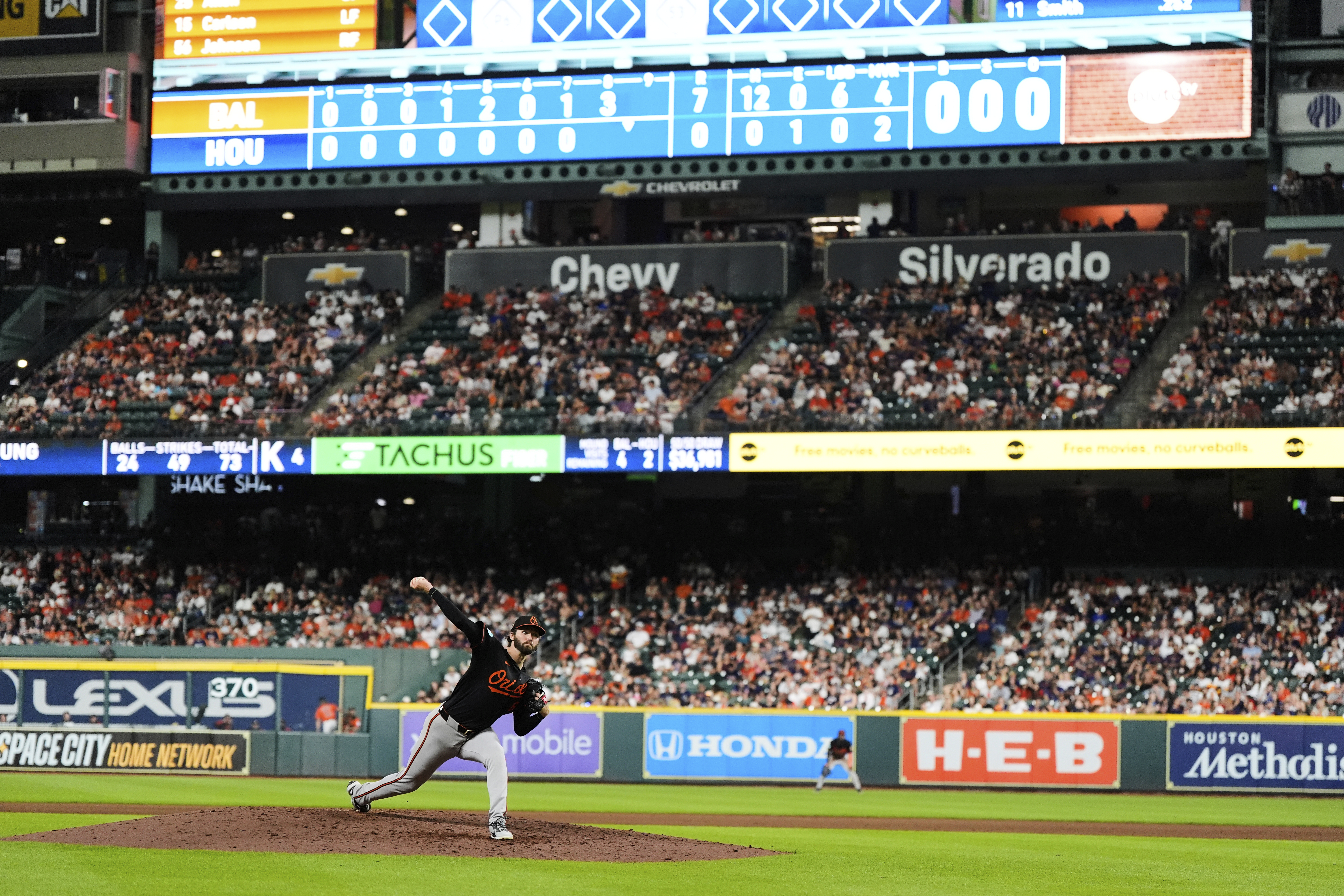 Baltimore Orioles starting pitcher Brandon Young throws during the eighth inning of a baseball game against the Houston Astros in Houston, Friday, Aug. 15, 2025.