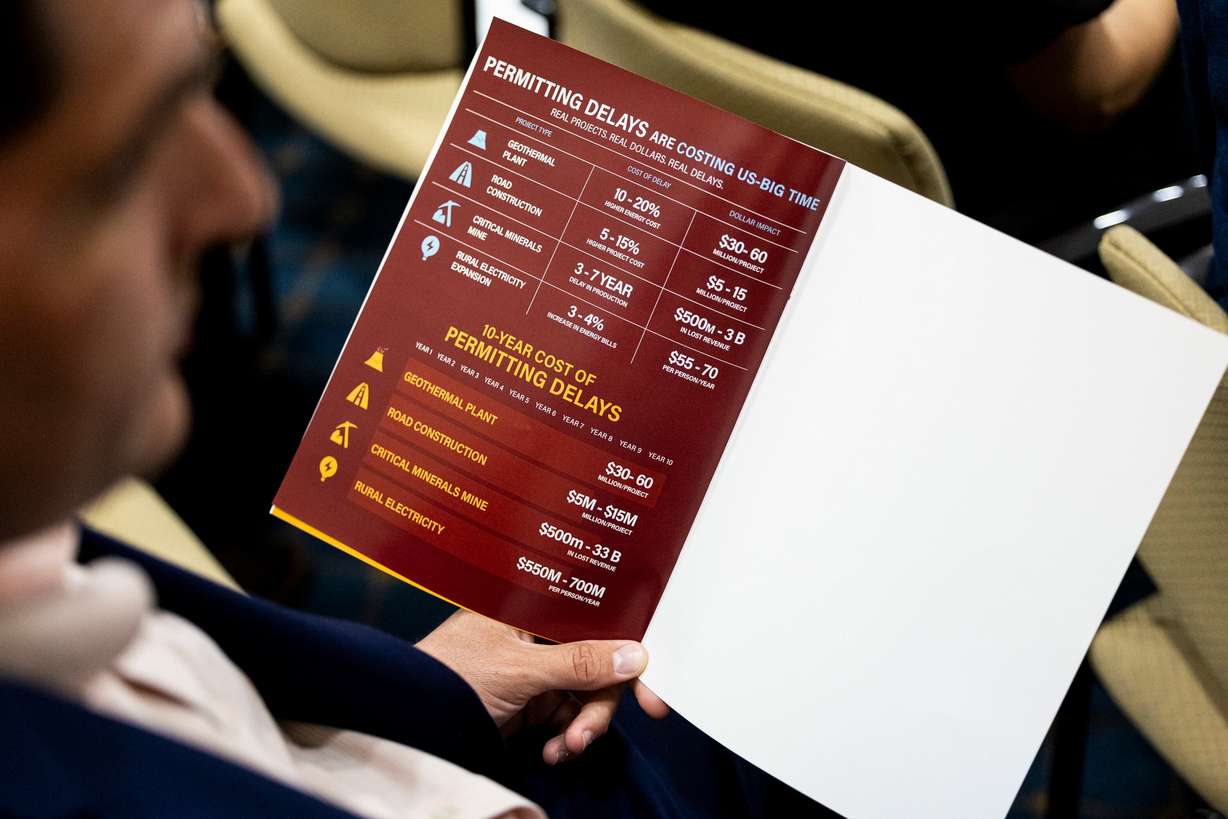 An attendee holds a program during an annual Regulatory Reform Summit held by Rep. Celeste Maloy, R-Utah, in the Senate Building of the Capitol in Salt Lake City on Friday.