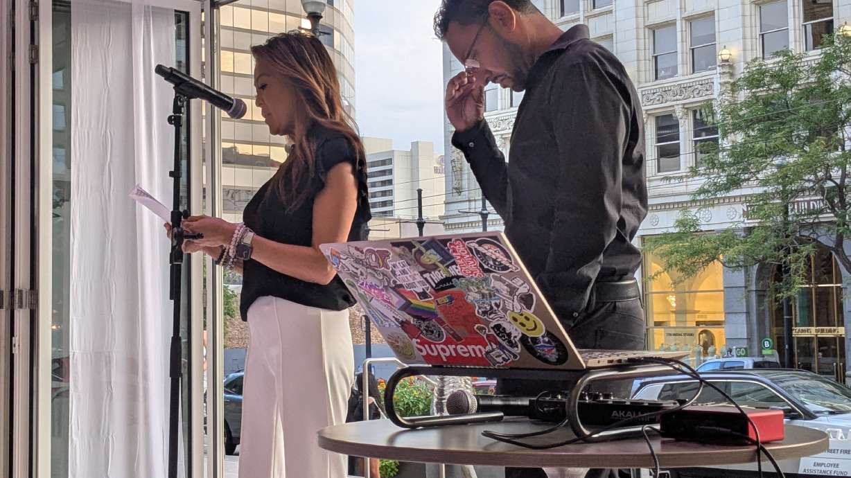 Kait Paulraj, left, speaks at the Main Street Fashion Show on Friday about losing her restaurant, London Belle Supper Club, during Monday's fire in downtown Salt Lake City. The fashion show held a fundraiser for the Main Street Fire employee assistance fund.