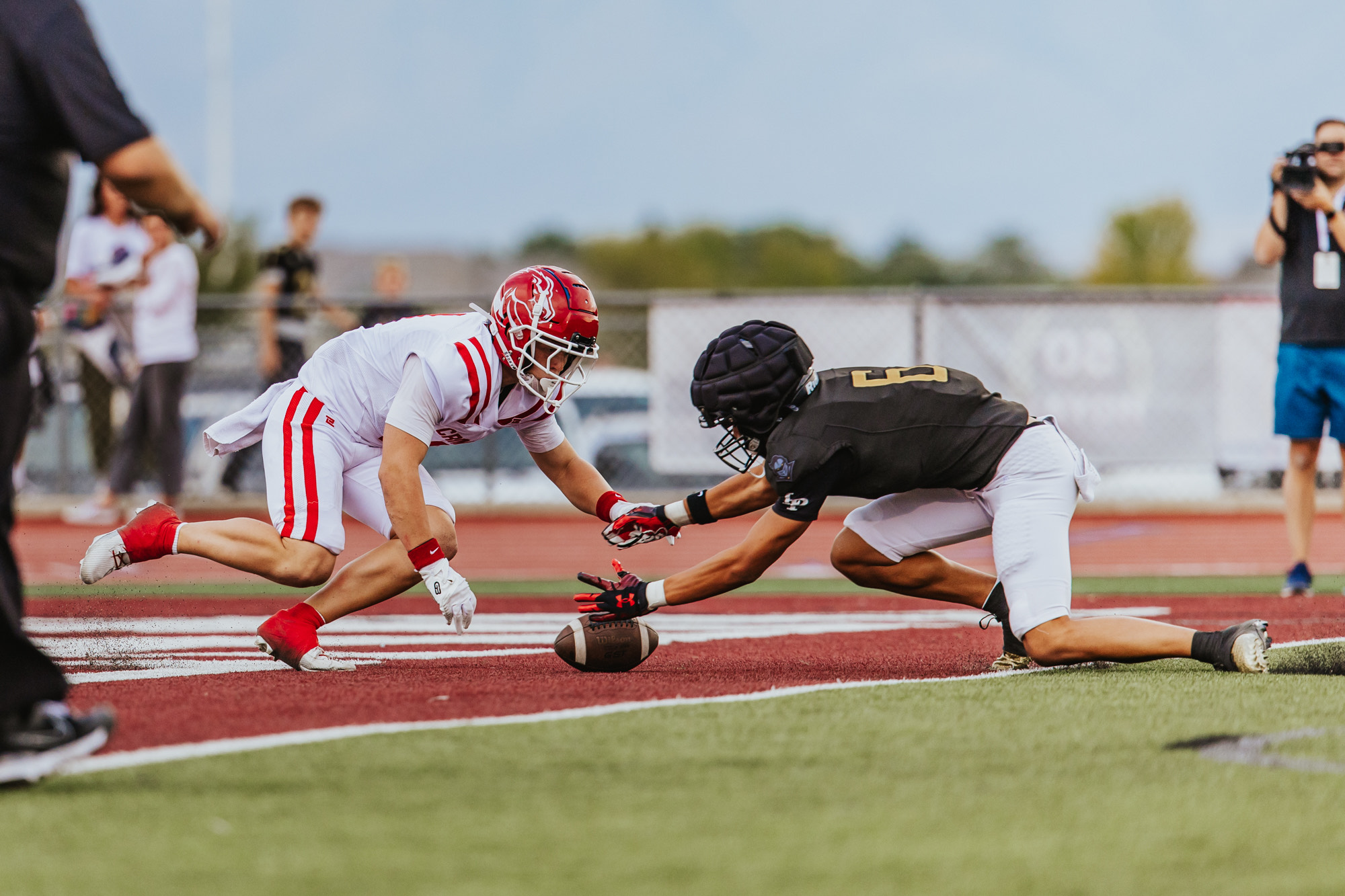 Lone Peak's Toatele Afu recovers a missnapped punt in the end zone during the Knights' 2025 high school football season opener against Crimson Cliffs, Friday, Aug. 15, 2025 in Highland, Utah.