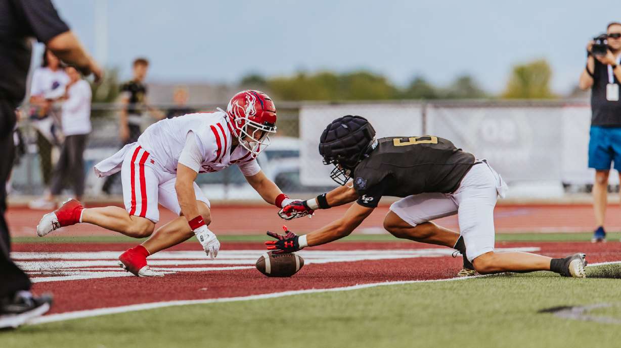 Lone Peak's Toatele Afu recovers a missnapped punt in the end zone during the Knights' 2025 high school football season opener against Crimson Cliffs, Friday, Aug. 15, 2025 in Highland, Utah.