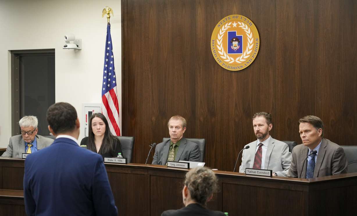 Members of the Utah Board of Pardons and Parole listen during closing arguments for a commutation hearing for Ralph Menzies at the Utah State Correctional Facility in Salt Lake City on Friday.