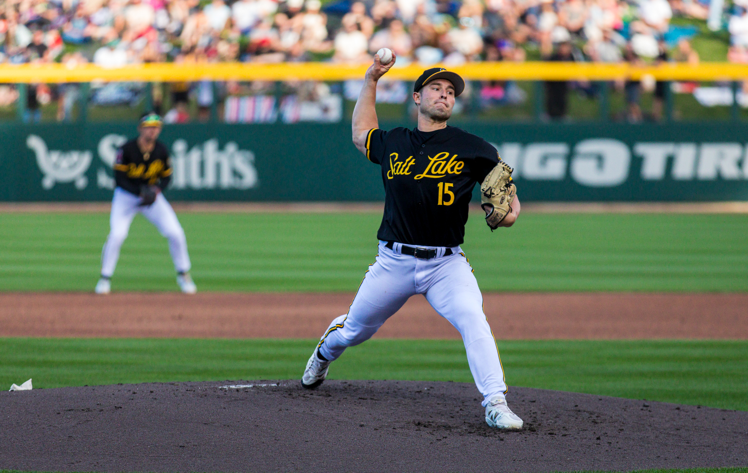 Salt Lake Bees pitcher Brett Kerry throws a pitch during a game between the Bees and Las Vegas Aviators at The Ballpark at America First Square in South Jordan on Aug. 9. The team's black alternate is the top-selling jersey and one of the most commonly selected jerseys worn by the team this year.