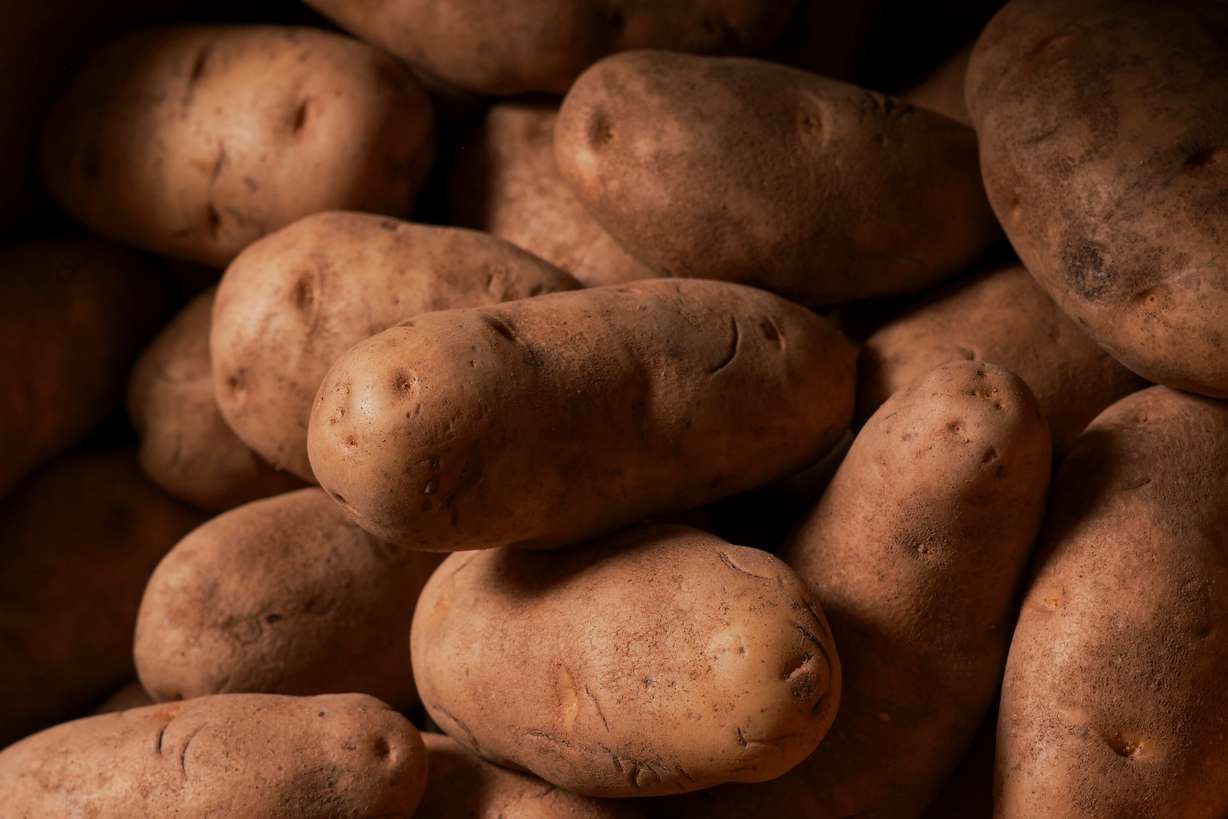 Potatoes sit in a box in the Student Nutrition Access Center, or SNAC, food pantry at Utah State University in Logan on Aug. 11