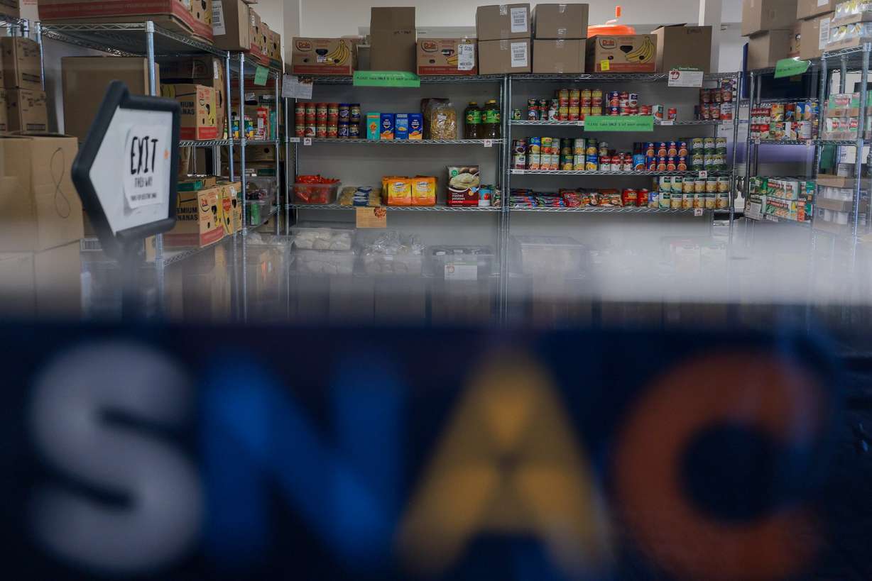 Food sits on the shelves of the Student Nutrition Access Center, or SNAC, food pantry at Utah State University in Logan on Aug. 11