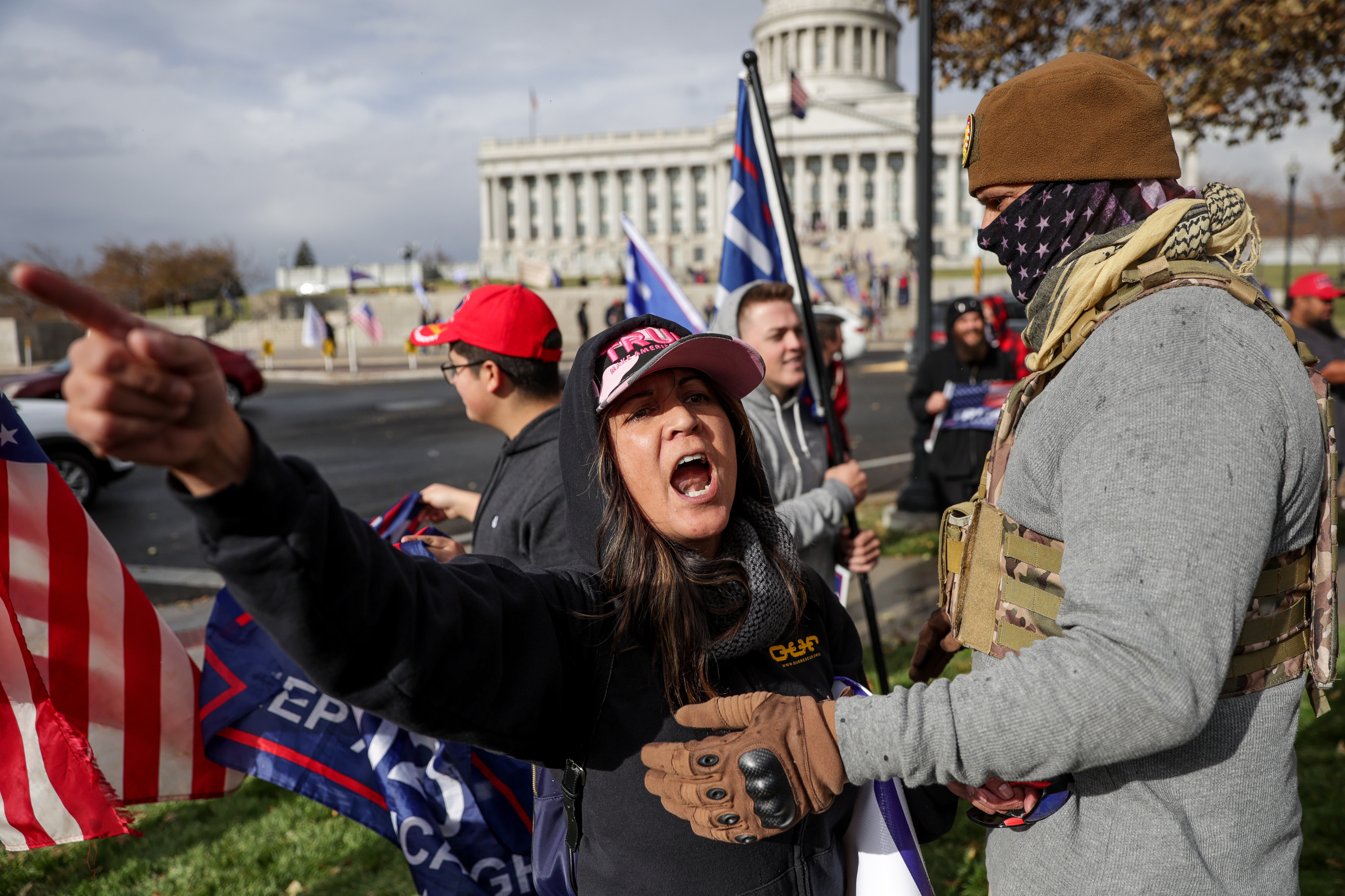 Supporters of President Donald Trump argue with backers of then-former Vice President Joe Biden across the street from the Capitol in Salt Lake City on Nov. 7, 2020.
