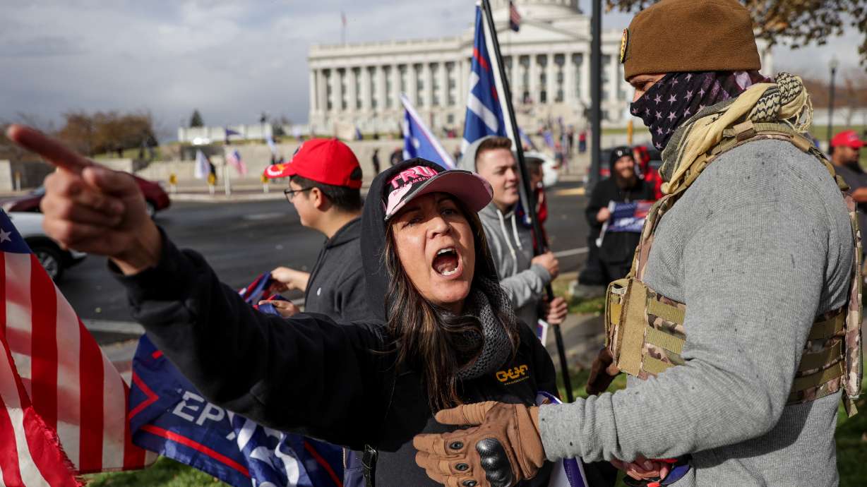 Supporters of President Donald Trump argue with backers of then-former Vice President Joe Biden across the street from the Capitol in Salt Lake City on Nov. 7, 2020.
