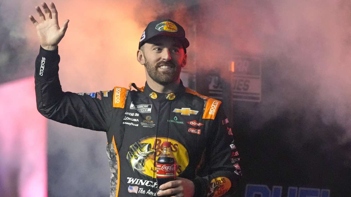 FILE - Austin Dillon waves during driver introductions before two NASCAR Daytona 500 qualifying auto races at Daytona International Speedway, Feb. 13, 2025, in Daytona Beach, Fla.