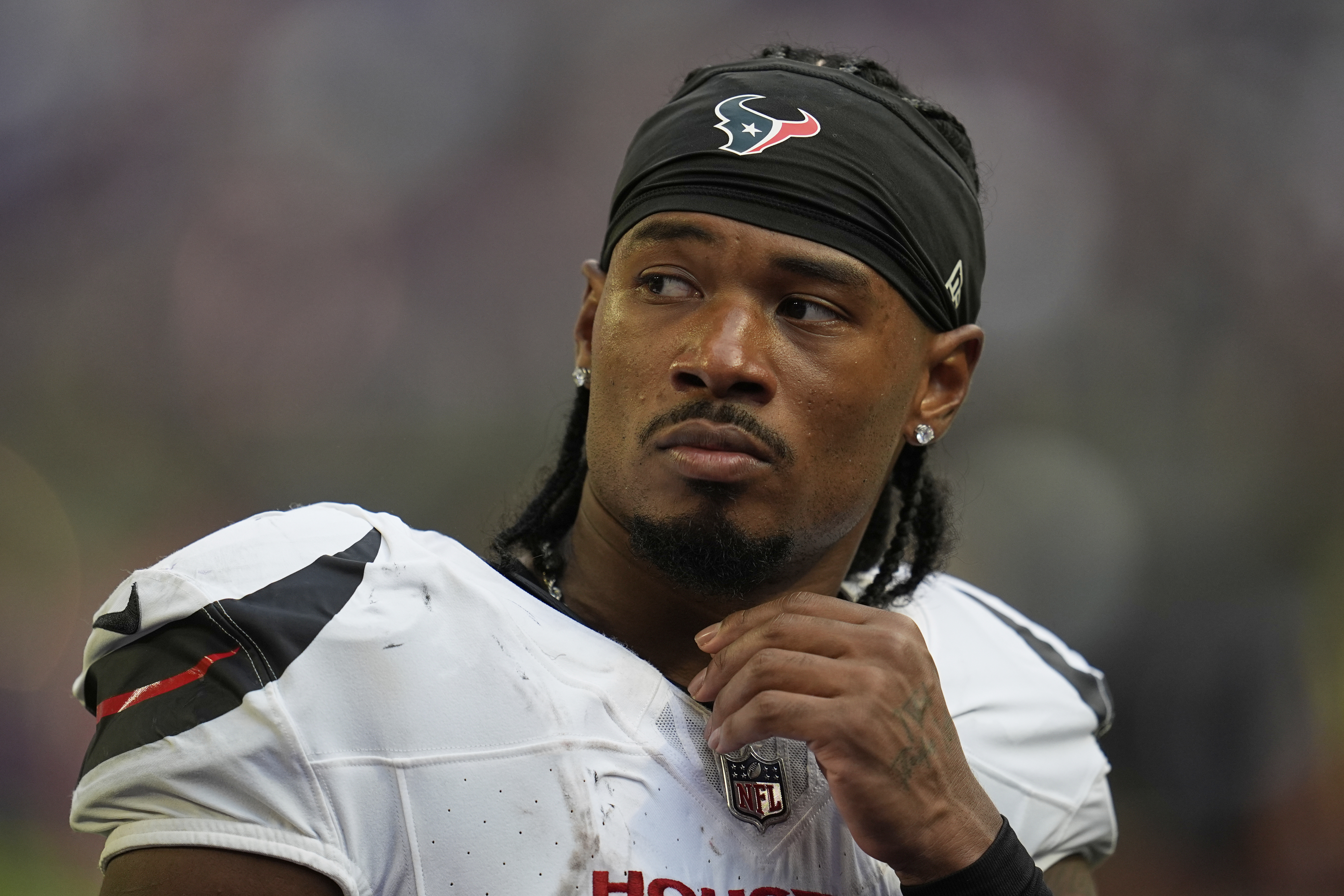FILE - Houston Texans wide receiver John Metchie III leaves the field after an NFL preseason football game against the Minnesota Vikings, Aug. 9, 2025, in Minneapolis. 