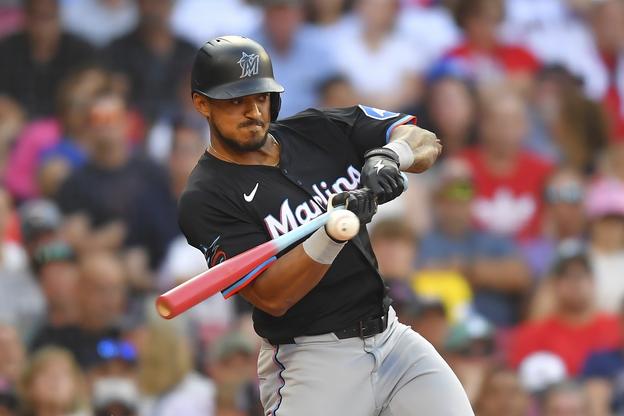 Miami Marlins' Dane Myers uses a bat decorated for players' weekend as he swings at a pitch in the seventh inning of a baseball game against the Boston Red Sox, Saturday, Aug. 16, 2025, in Boston. 