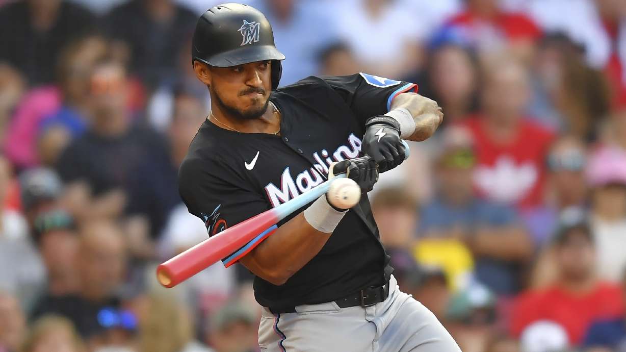 Miami Marlins' Dane Myers uses a bat decorated for players' weekend as he swings at a pitch in the seventh inning of a baseball game against the Boston Red Sox, Saturday, Aug. 16, 2025, in Boston.