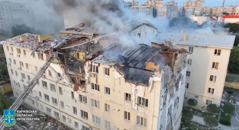A drone view shows smoke rising from damaged buildings, at the site of an apartment building hit by a Russian drone strike, amid Russia's attack on Ukraine, at a location given as Kharkiv, Ukraine, in this screengrab taken from a video released on Monday.