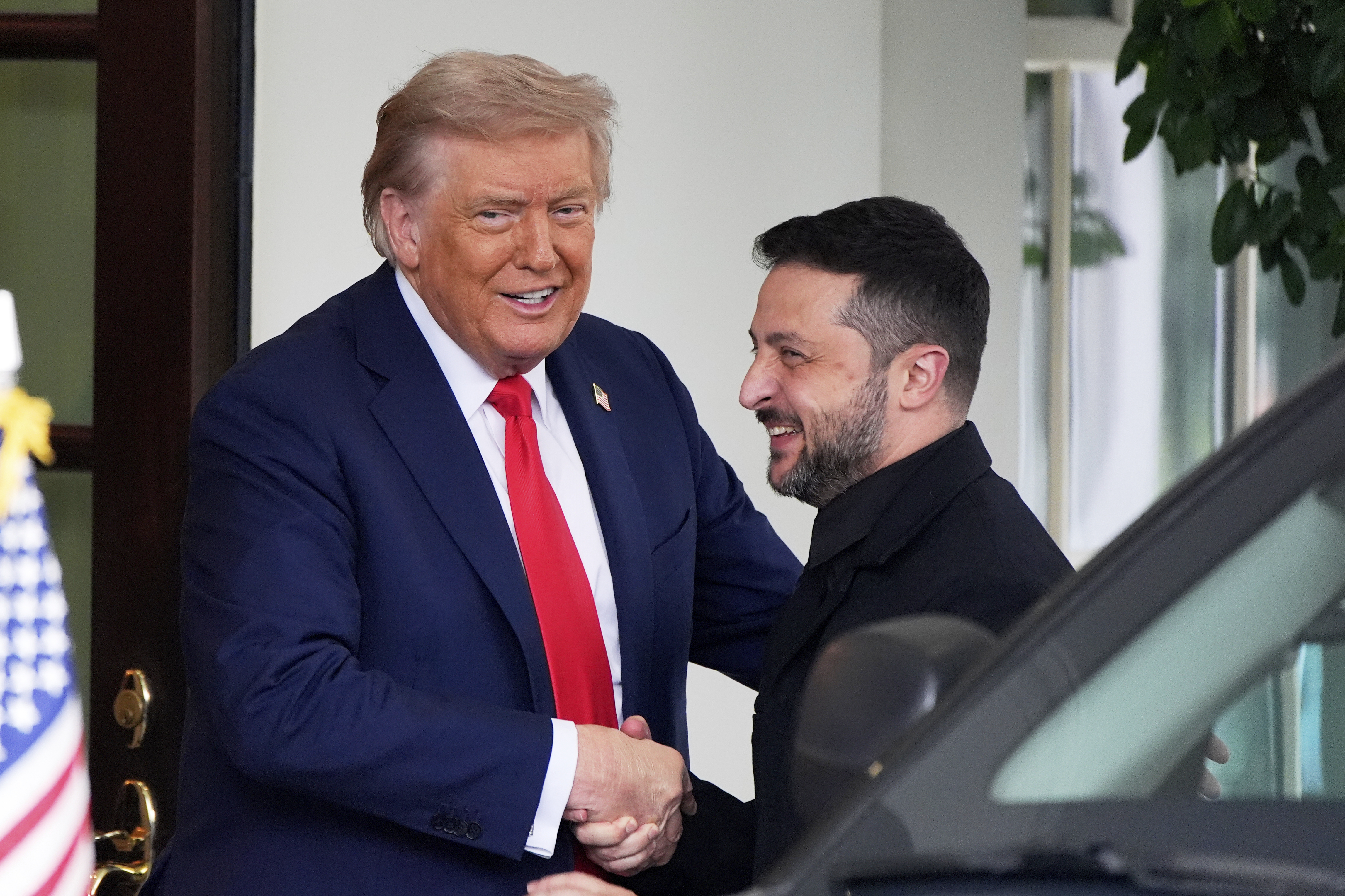 President Donald Trump, left, greets Ukraine's President Volodymyr Zelenskyy as he arrives at the White House, Monday in Washington.