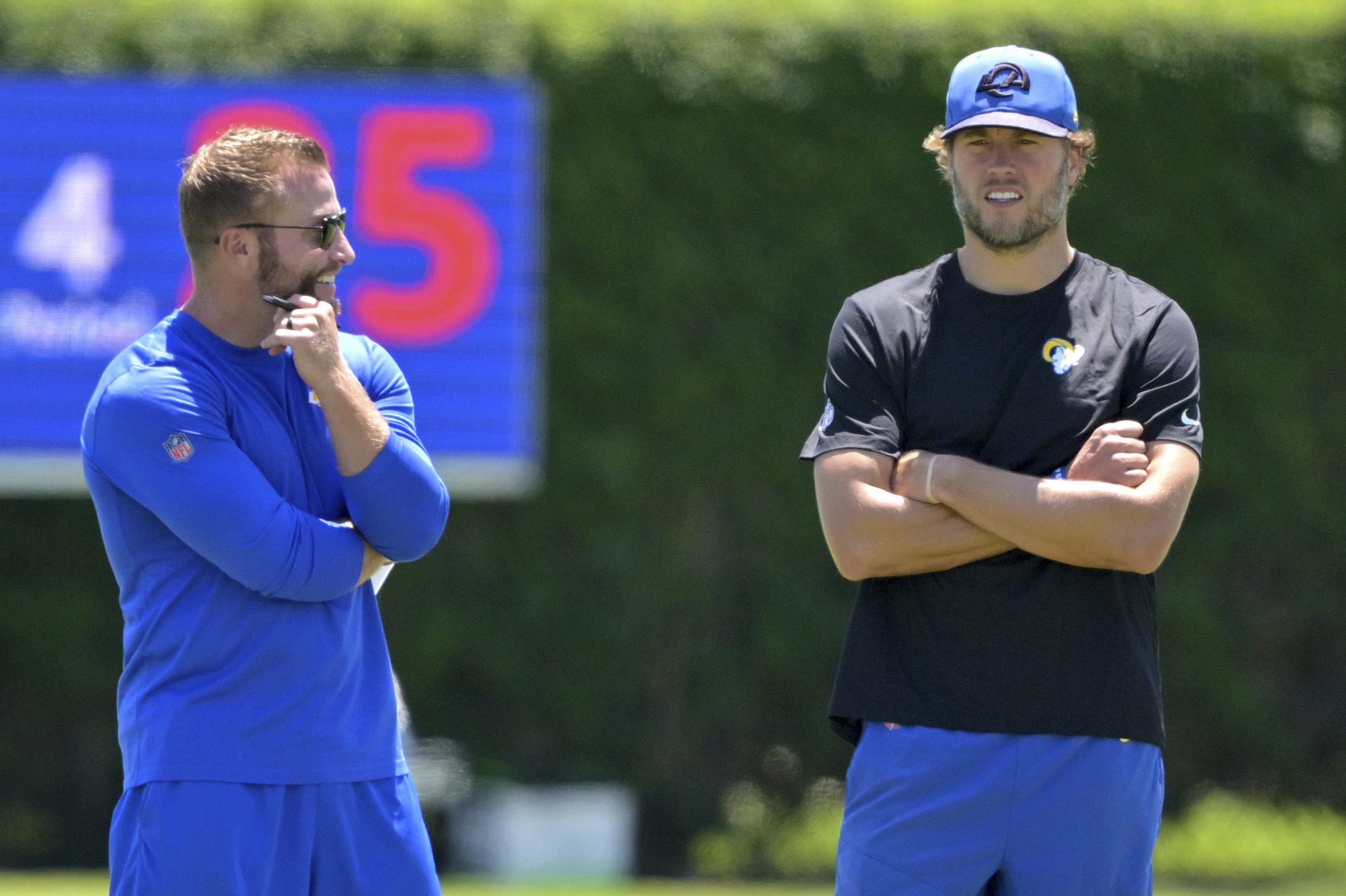 Los Angeles Rams head coach Sean McVay, left, talks with quarterback Matthew Stafford, right, during an NFL football practice Saturday, July 26, 2025, in Los Angeles, Calif. 