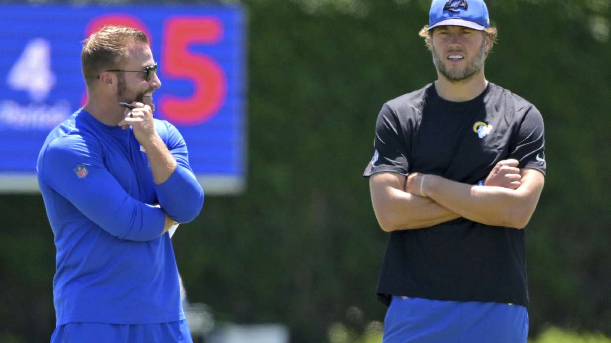 Los Angeles Rams head coach Sean McVay, left, talks with quarterback Matthew Stafford, right, during an NFL football practice Saturday, July 26, 2025, in Los Angeles, Calif.