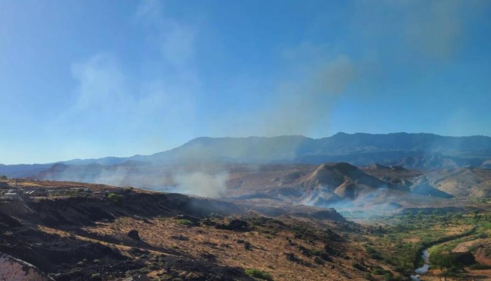 A human-caused fire burns near Virgin River Confluence Park just north of Hurricane, Washington County, Sunday. 