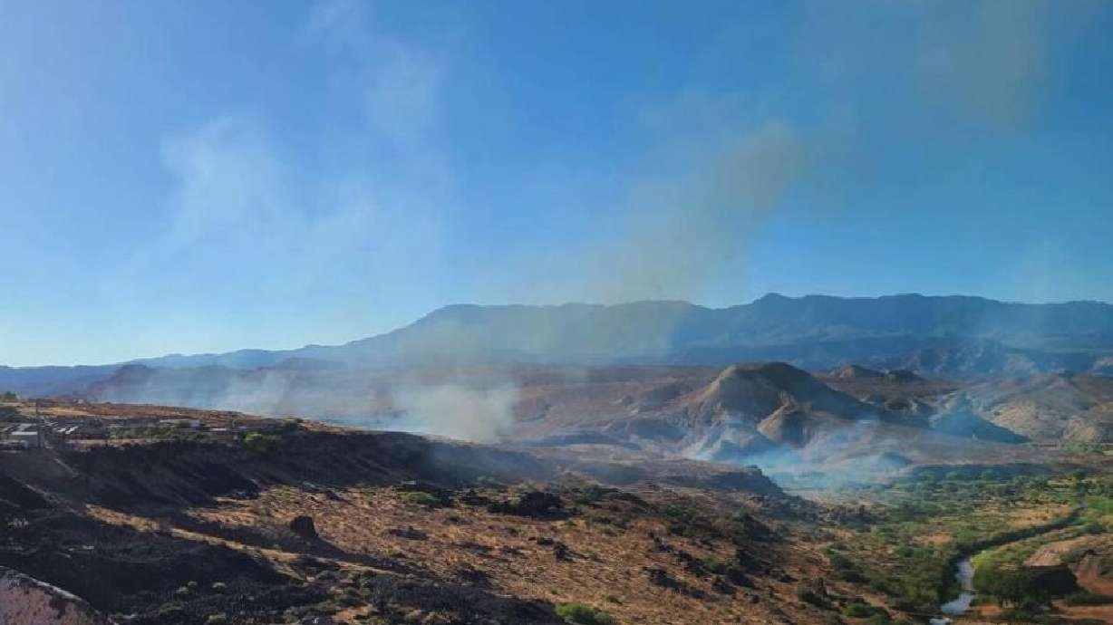A human-caused fire burns near Virgin River Confluence Park just north of Hurricane, Washington County, Sunday.