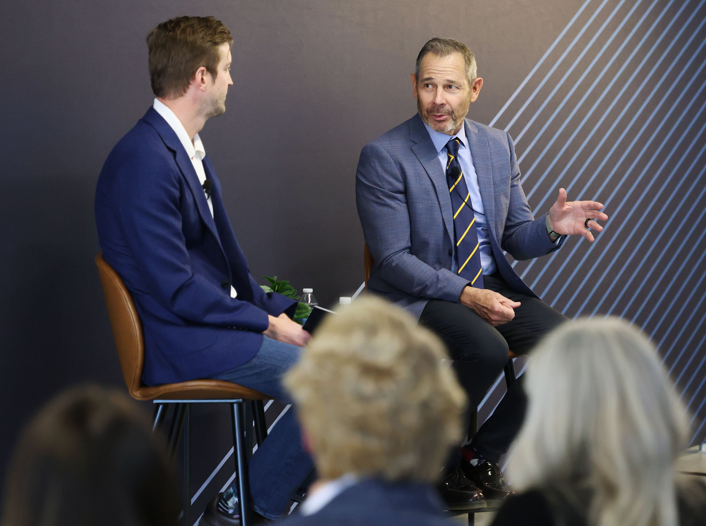 Sen. John Curtis speaks with Strider CEO Greg Levesque, left, during a town hall at Strider Technologies in South Jordan on Monday.