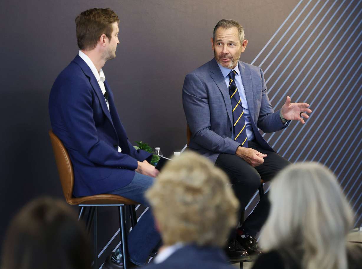 Sen. John Curtis speaks with Strider CEO Greg Levesque, left, during a town hall at Strider Technologies in South Jordan on Monday.