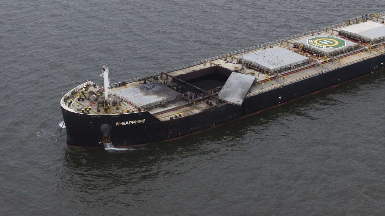 The W-Sapphire bulk carrier is seen anchored off Sandy Point, Md., the morning after an explosion occurred in one of its holds as it was leaving the Port of Baltimore, Tuesday.