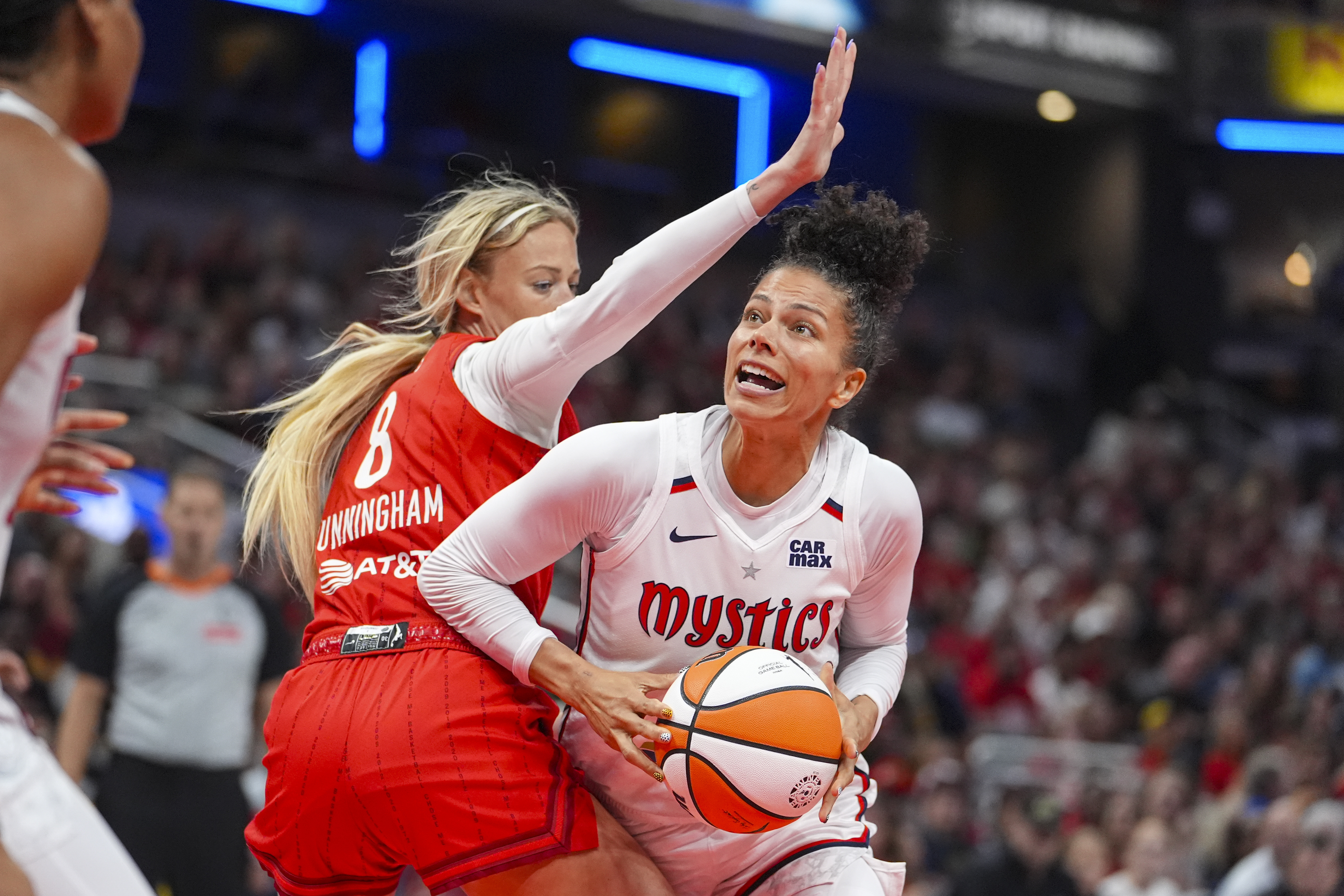 Washington Mystics forward Alysha Clark (32) looks to shoot around Indiana Fever guard Sophie Cunningham (8) in the second half of a WNBA basketball game in Indianapolis, Friday, Aug. 15, 2025.