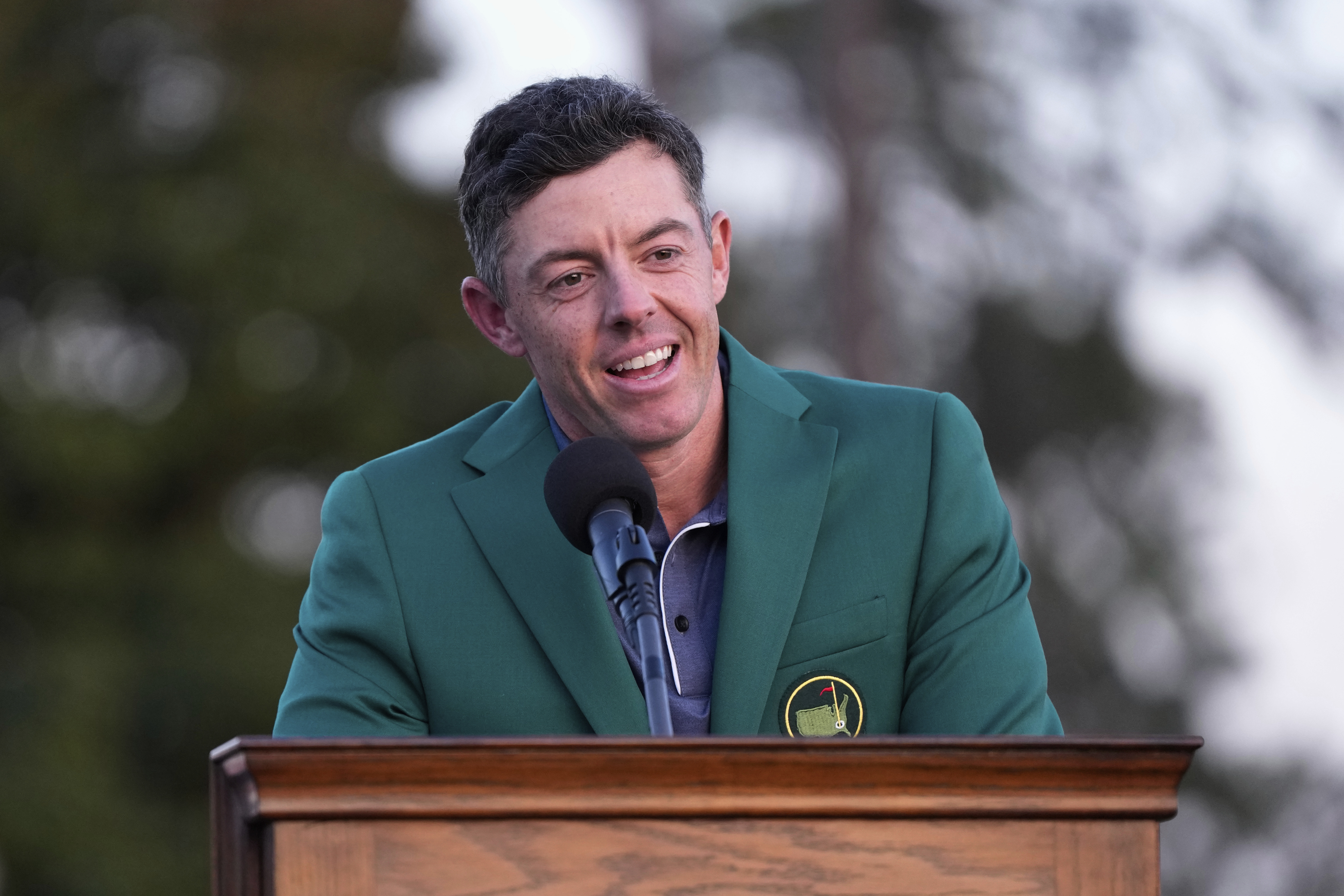 FILE - Rory McIlroy, of Northern Ireland, speaks after putting on the Masters green jacket after winning the Masters golf tournament on April 13, 2025, in Augusta, Ga. 