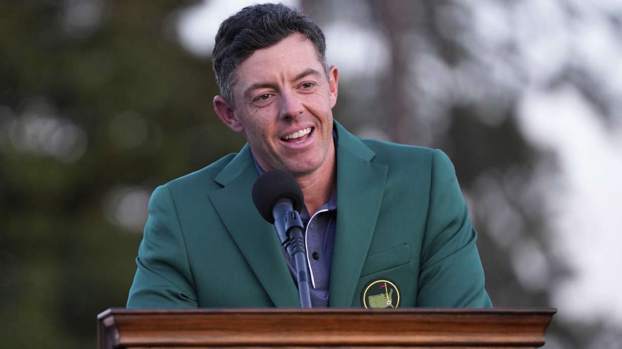FILE - Rory McIlroy, of Northern Ireland, speaks after putting on the Masters green jacket after winning the Masters golf tournament on April 13, 2025, in Augusta, Ga.
