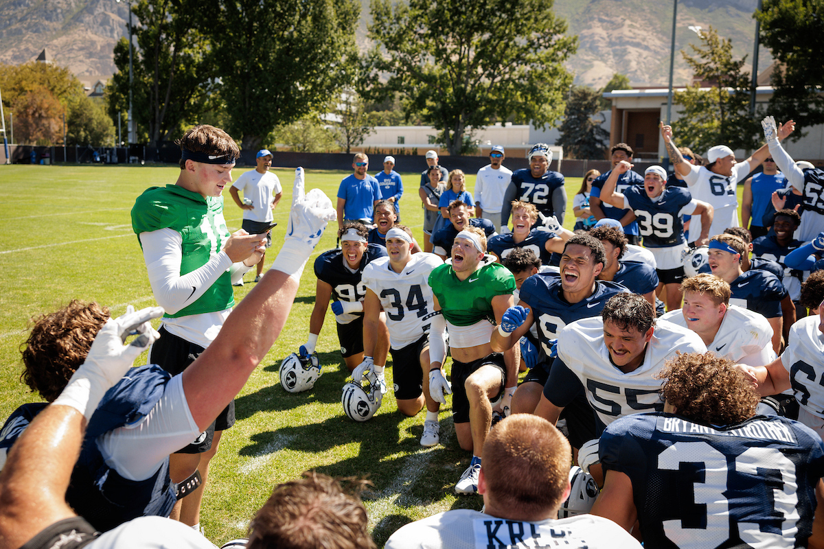 BYU quarterback Emerson Geilman reads his church mission call to his teammates after practice, Tuesday, Aug. 19, 2025. The former Bountiful High standout will serve a two-year mission for The Church of Jesus Christ of Latter-day Saints in Sao Paulo, Brazil following the season.