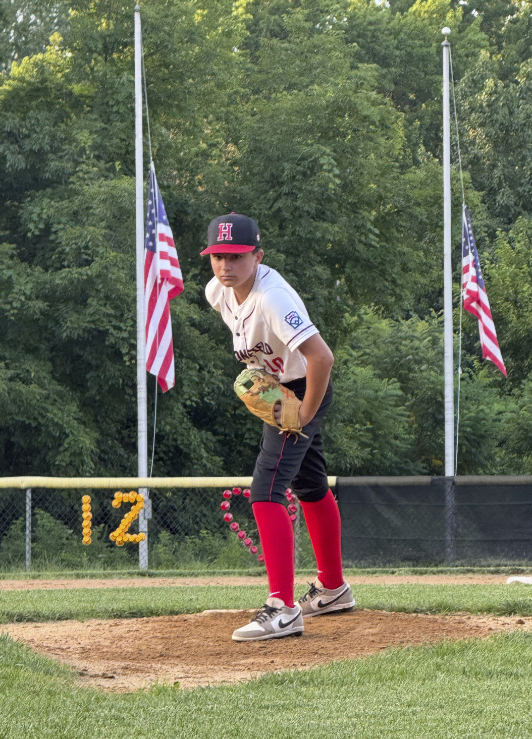 FILE - In this undated photo provided by Joseph "Joe" Rocco, his son, Marco Rocco, prepares to deliver a pitch in a baseball game in Haddonfield, N.J.